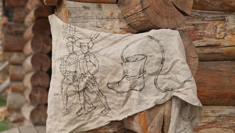 Drawing-of-travelers-and-boot-on-piece-of-cloth-on-wall