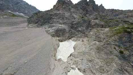 FPV-drone-approaching-a-rocky-alpine-mountain-in-Tyrol,-Austria