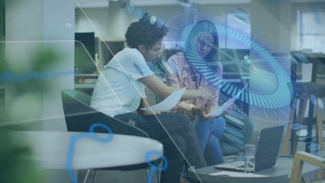two people discussing documents in office with digital data overlay animation