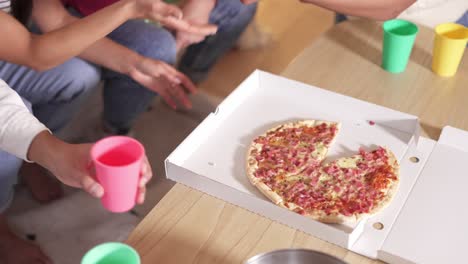 pizza in a box at a casual gathering with friends