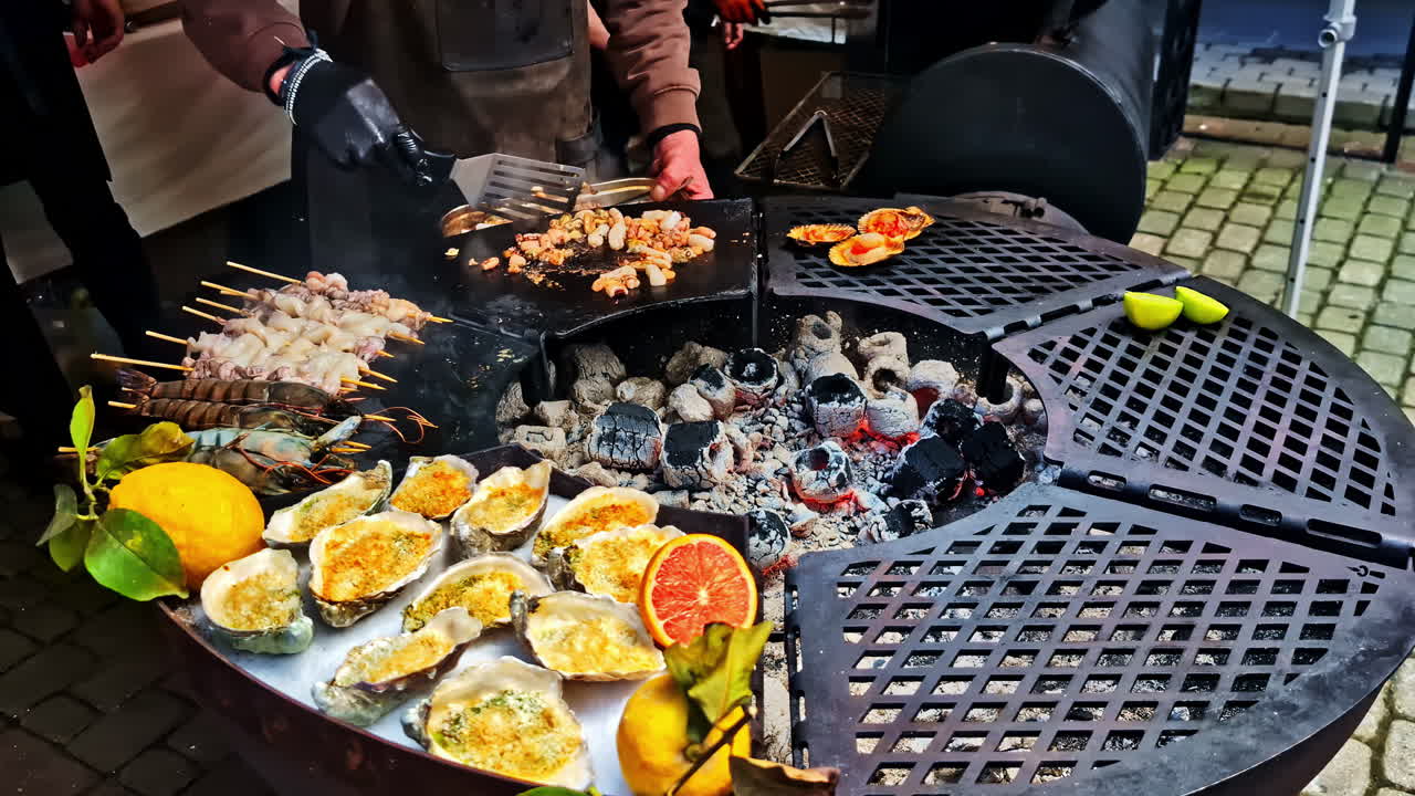 Grilled Oysters, Skewered Seafood, and Citrus Garnishes Sizzle Over Hot Coals at a Bustling Outdoor Food Event - Close Up