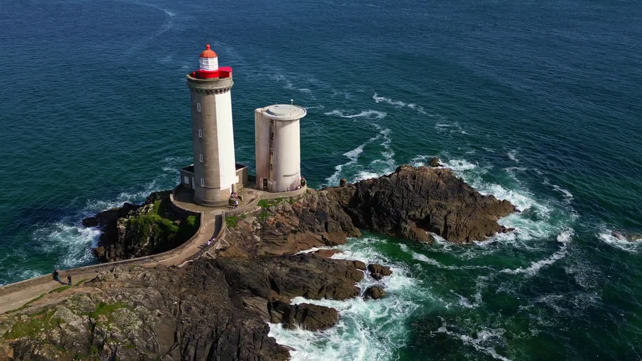 Panning drone movement near the Petit Minou lighthouse's two cylindrical towers, Plouzané, Finistère, Brittany, France