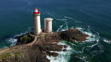 panning drone movement near the petit minou lighthouse's two cylindrical towers, plouzané, finistère, brittany, france