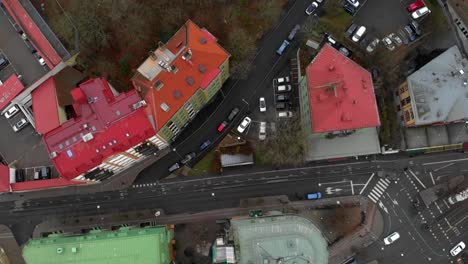 Aerial-of-Gothenburg-city-with-large-buildings-and-car-traffic-on-streets