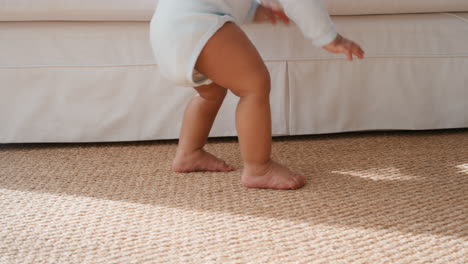 cute-baby-learning-to-walk-happy-toddler-having-fun-taking-first-steps-walking-enjoying-childhood-curiosity-at-home-4k