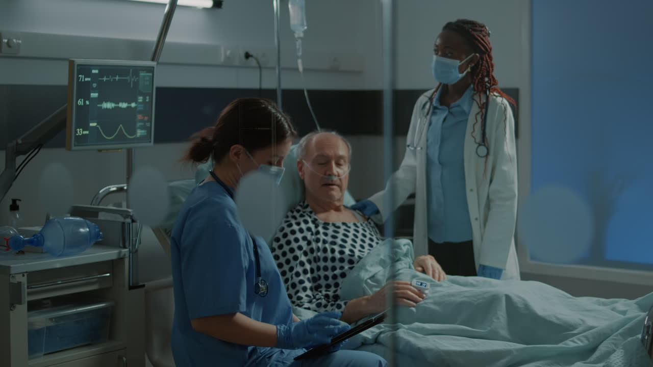 Nurse and african american medic checking on patient