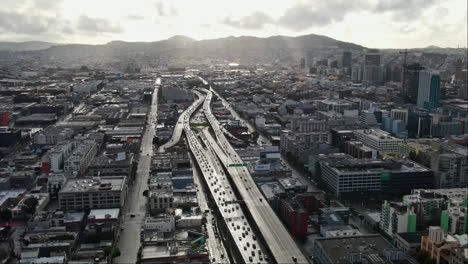 aerial of san francisco cityscape, highway traffic under the cloudy grey sky, california, usa