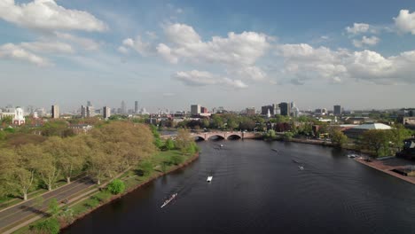 charles river, boston with rowing teams from harvard university, 4k aerial