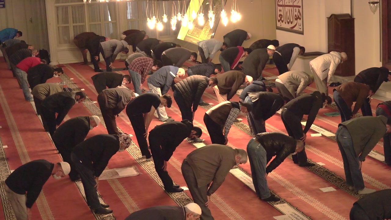 Group of Men Praying Together in a Mosque