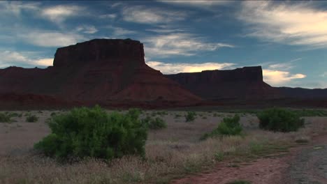 long shot of castle rock standing in the utah desert near moab