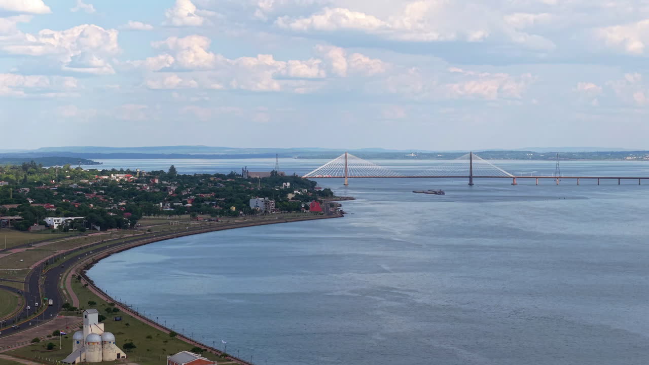 Drone View of San Roque González de Santa Cruz international bridge in Encarnación, Paraguay, connection with Posadas Argentina, Aerial