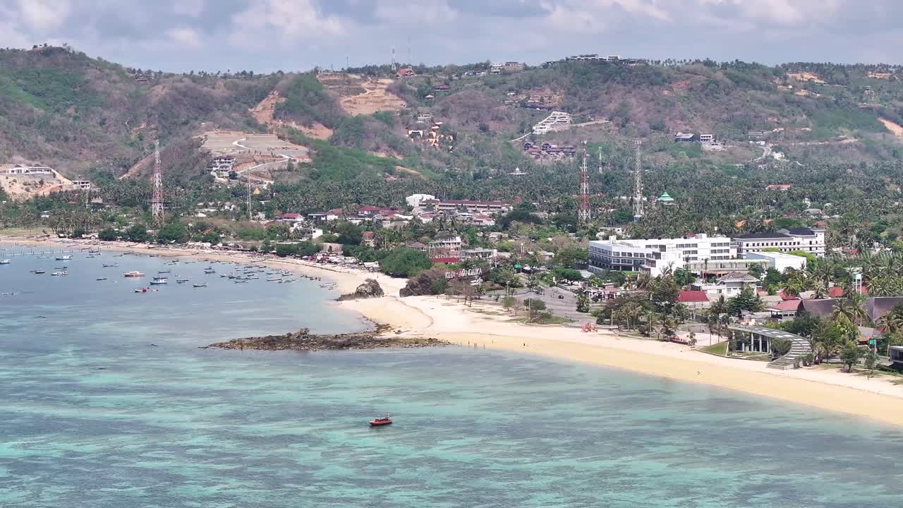Long sandy beach in Kuta Lombok, popular surfers destination in Lombok, Indonesia. Aerial