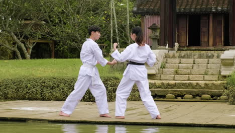 young couple fighting in class outdoors