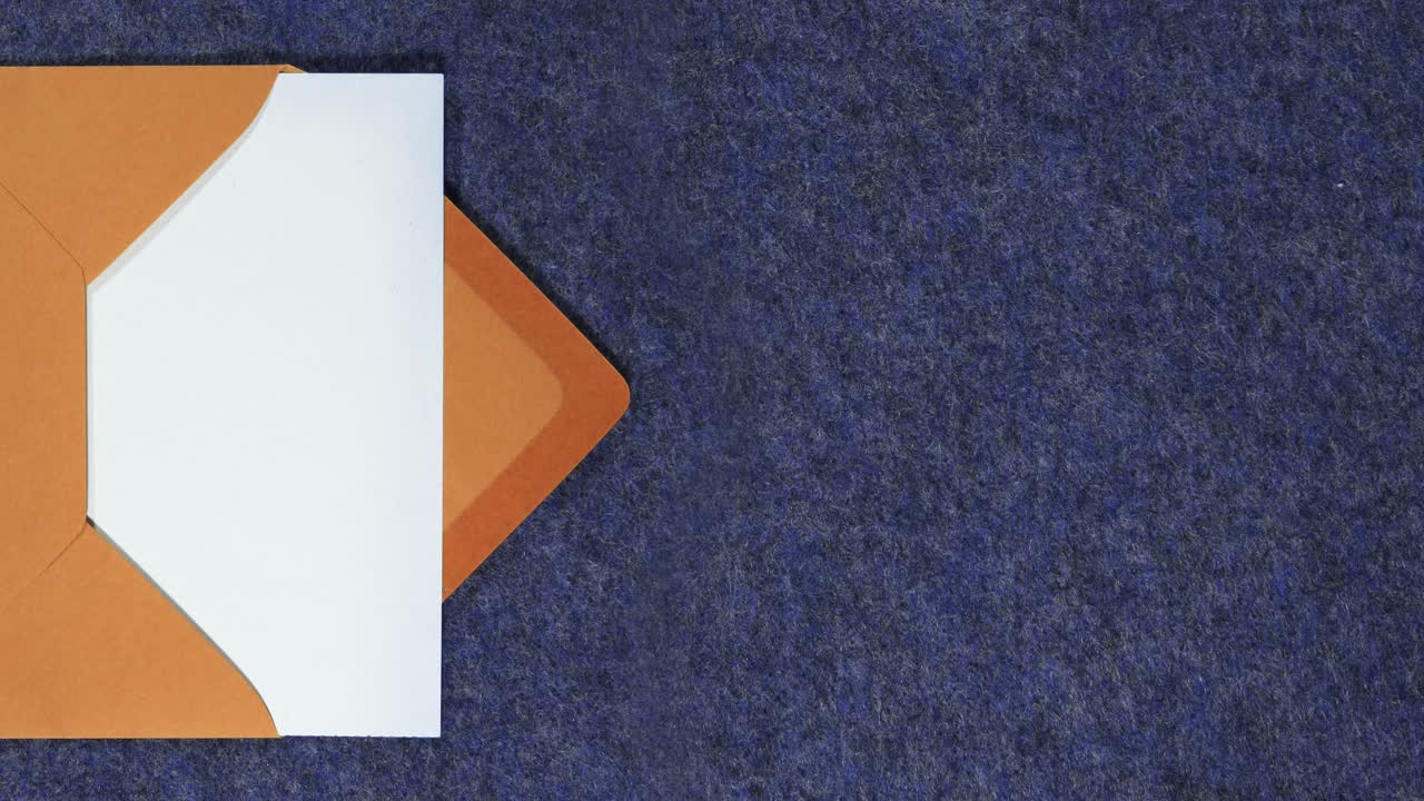 Orange letter envelope containing a white paper enters and exits the scene from the left of the screen