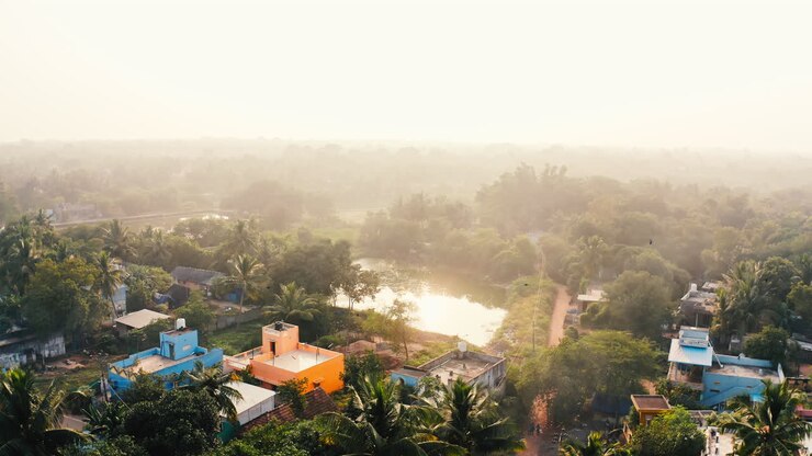 Misty Sunrise over a Rural Indian Village