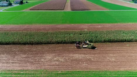 amish farmers harvesting there fall crops as seen by drone