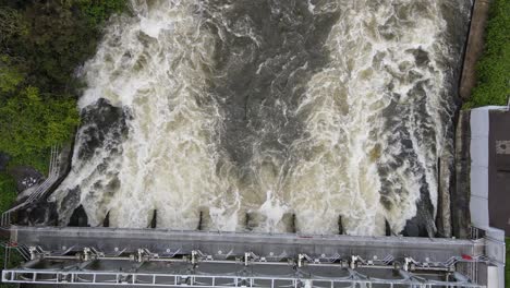 overhead drone footage of weir on river thames at marsh lock near henley uk