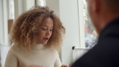 Young-Couple-Enjoying-Meal-On-Date-In-City-Restaurant