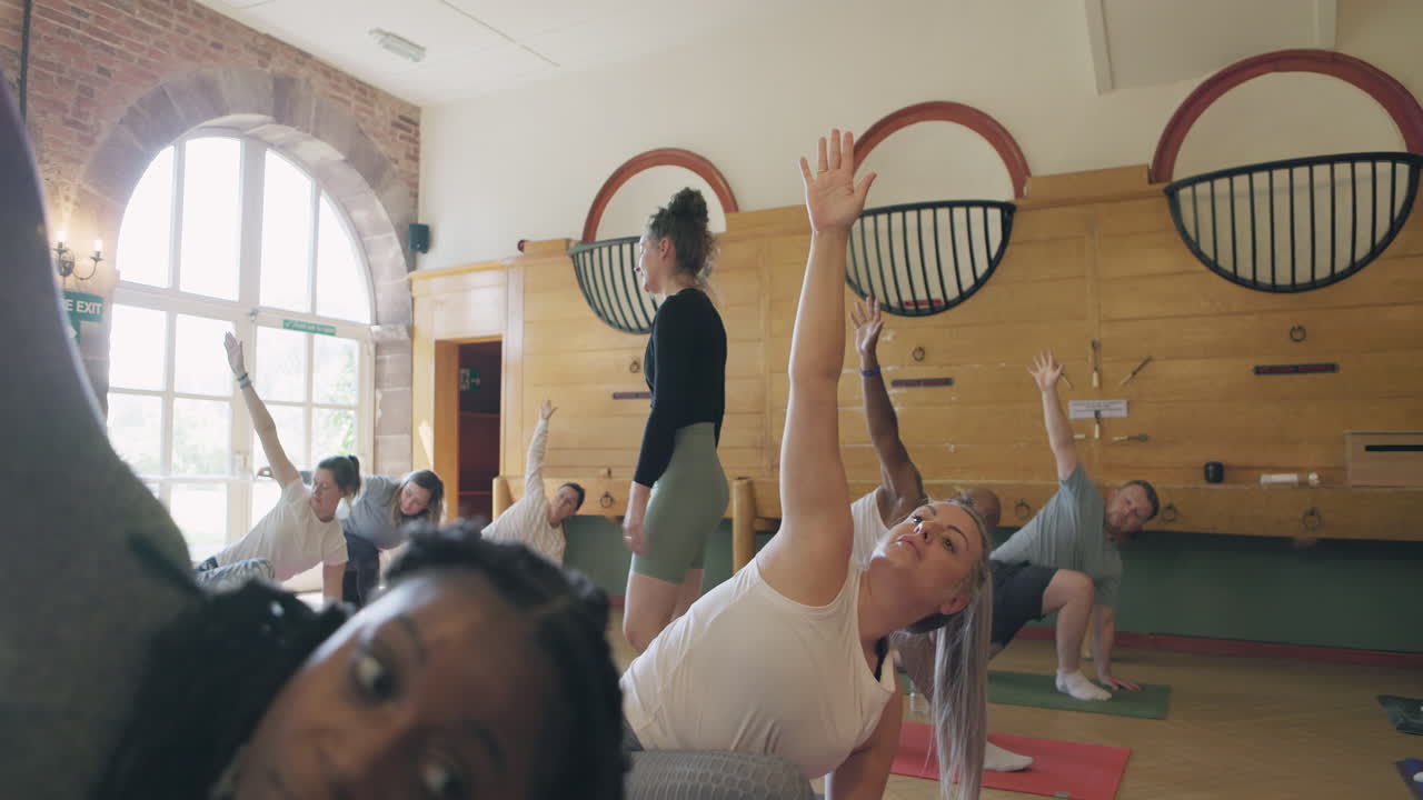 Yoga class with instructor indoors