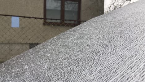 silver windshield cover foil in winter, snowing weather