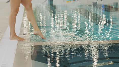 people entering a swimming pool