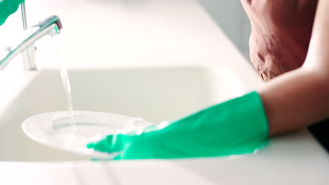 Hands,-water-and-washing-dishes-in-the-kitchen