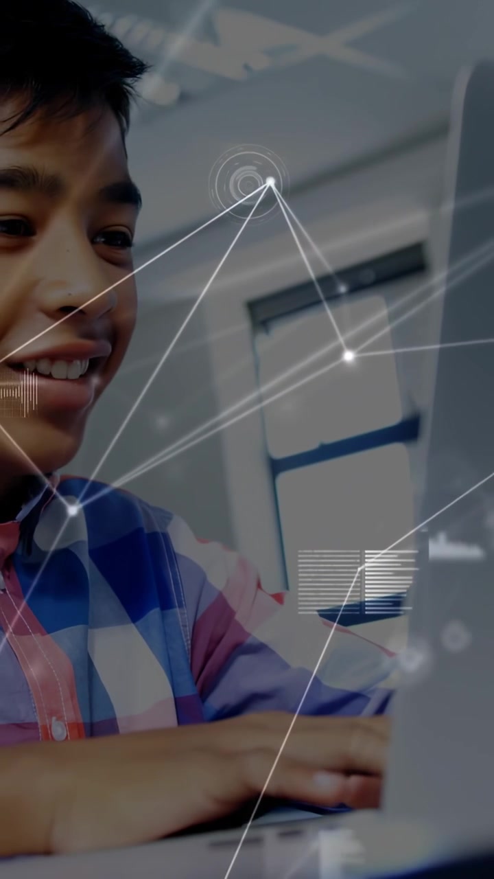 Vertical video: Camera pullback revealing teen at laptop typing smiling, data overlay showing work