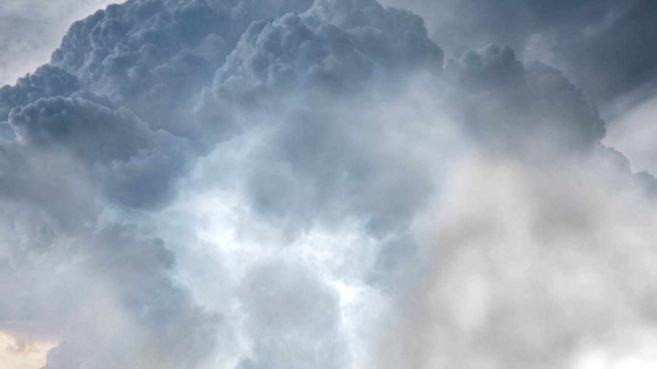 dark sky and storm behind in white clouds
