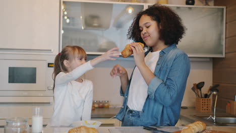 sisters enjoying breakfast croissants