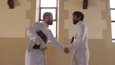 Fencer-athletes-during-a-fencing-training-in-a-gym