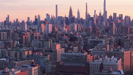 aerial view of the new york city skyline at dusk. shot in harlem looking south towards midtown manhattan.