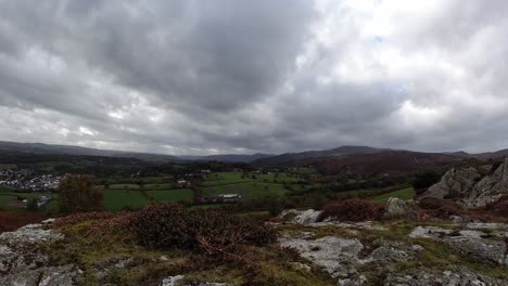 moody rolling stormy overcast clouds timlapse towards camera of rural english countryside farmland