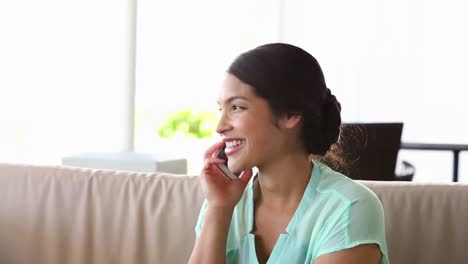 Businesswoman-answering-the-phone-outside