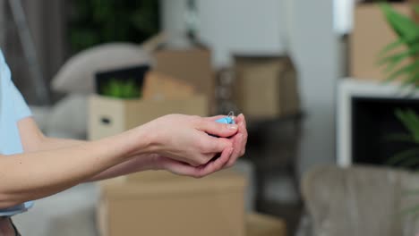 man handing keys of new house to woman customer. the happy couple have moved in a new house. selling home. real-estate agent job.