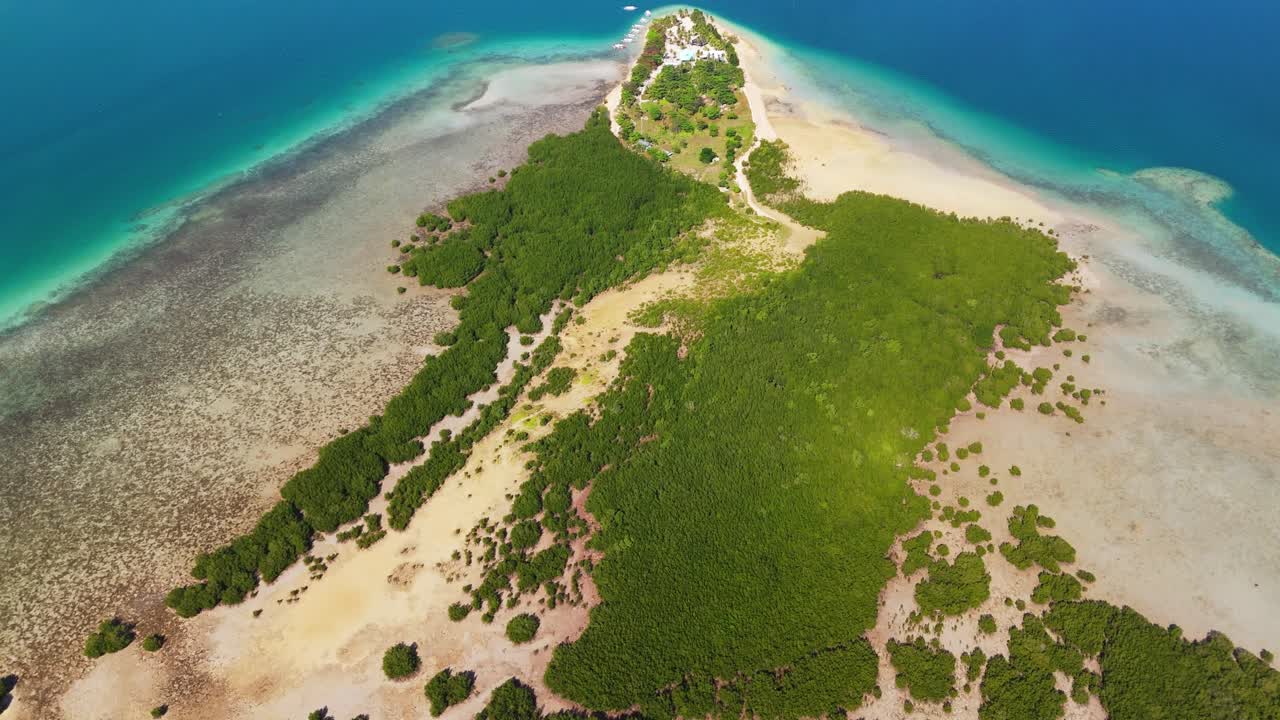 drone shot of Cowrie Island's white sand beaches and lush mangroves in Puerto Princesa, Honda Bay, Palawan