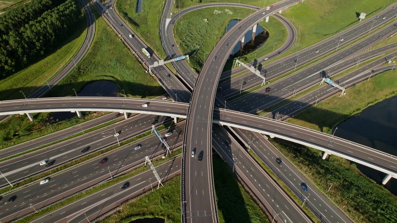 Above View Of Vehicles Traveling Across Highway Junction Of Ridderkerk In The Netherlands. Aerial Drone Shot