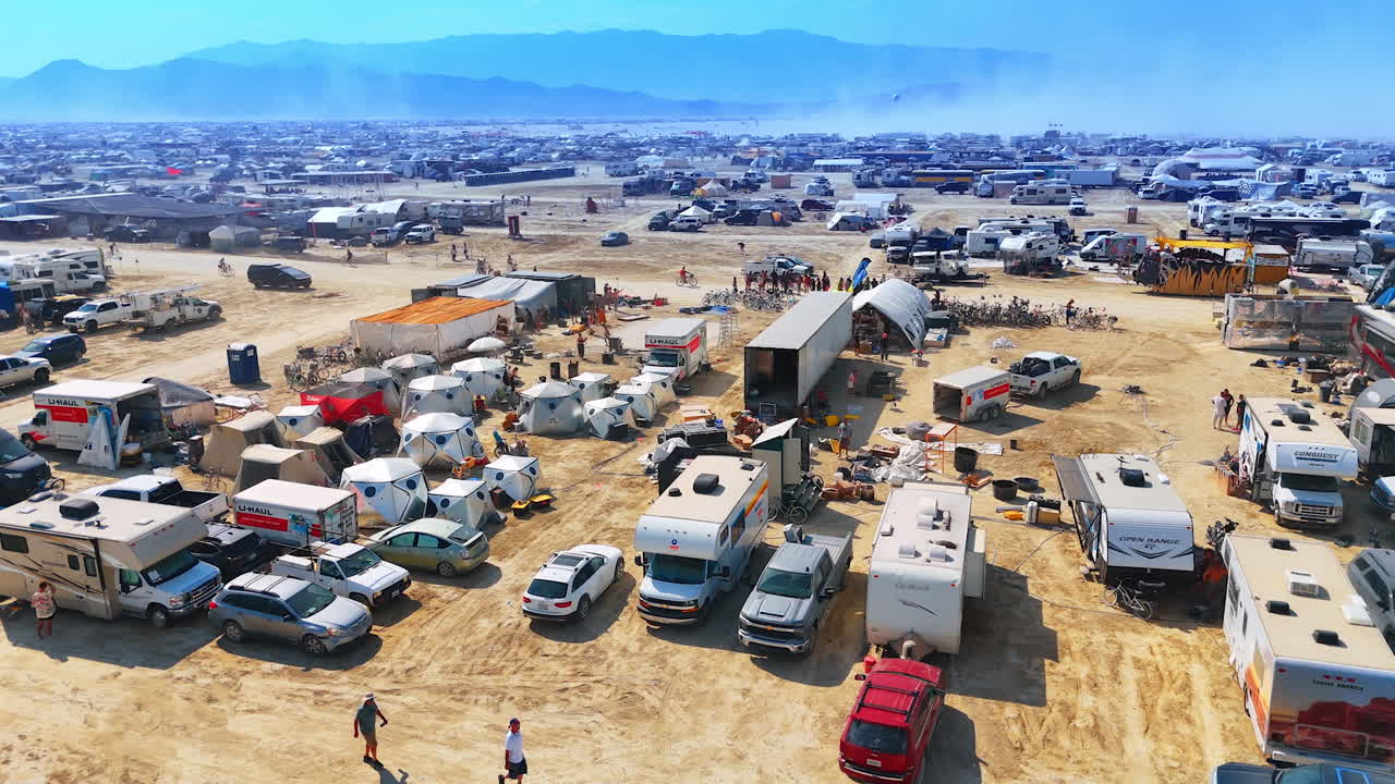 Nevada, USA, 14 August 2025: Burning Man campsite with tents and vehicles in Nevada desert.. Dozens of tents and RVs fill the campsite on the playa