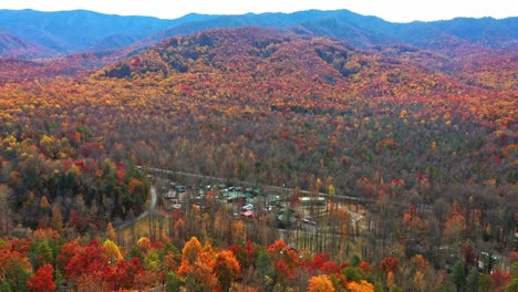 Village-surrounded-by-a-forest-of-trees-with-orange-tones-in-autumn