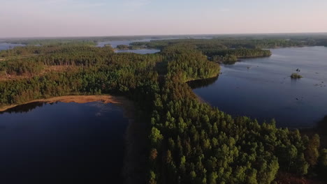 Aerial-of-a-lake-and-forest-in-Sweden