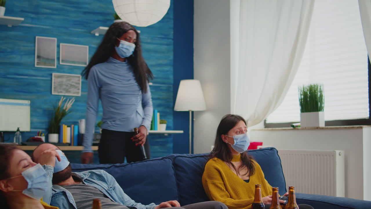 Sad friends because loosing playing video games with wireless controller