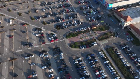 aerial time lapse shot of traffic on parking lot in outlet shopping center