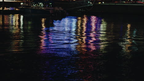 revealing shot of passenger terminal, a, port of tallinn illuminated with night light, estonia