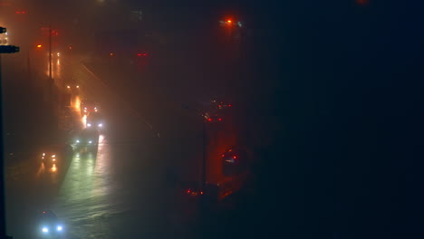 night city street in fog and rain