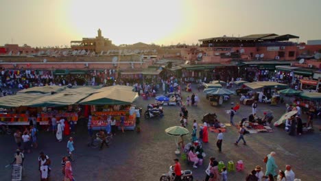 jemma el-fna square marrakesh morocco. late evening sunset with left to right pan.