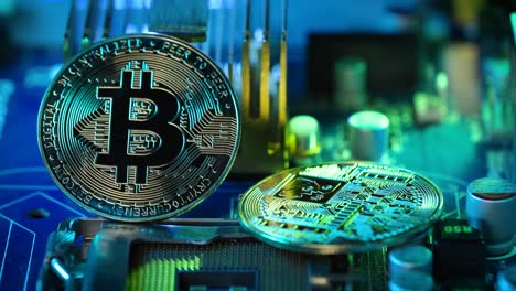 two crypto coins displayed on computer motherboard, technology environment, bitcoin