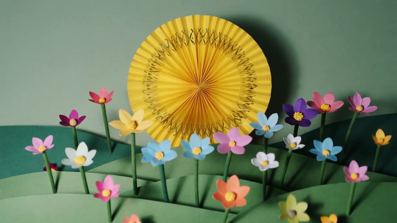 Building diorama on table frames causing paper blooms forming dense field before pleated yellow sun