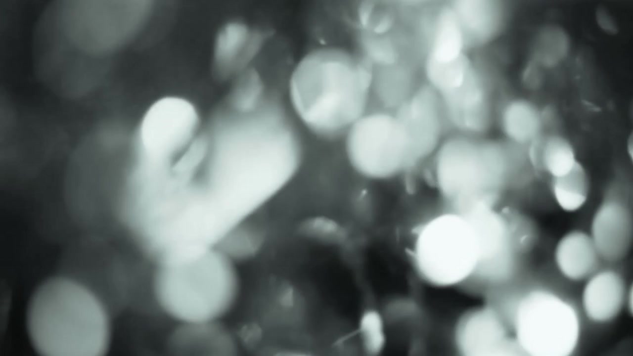 Sfondo astratto di bokeh di luce argentata scintillante