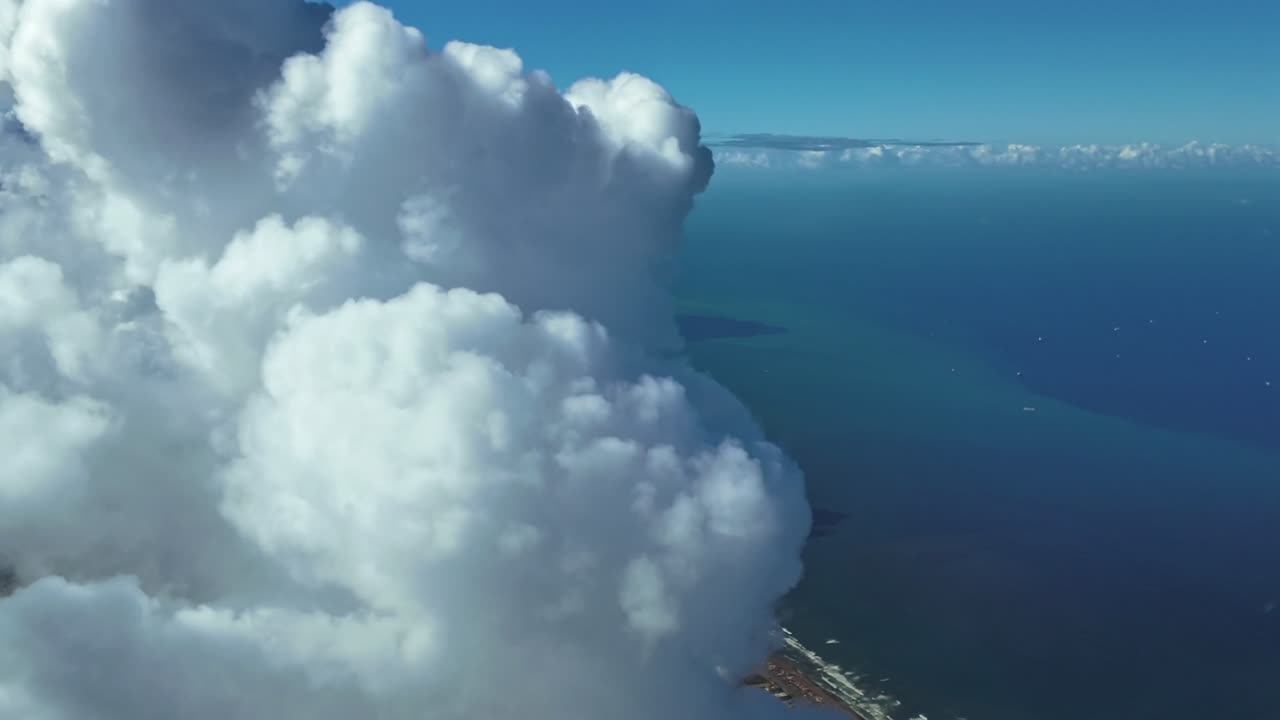 An immersive aerial view of Casablanca City take from a jet cockpit with a view of the city among towering clouds in a sunny afternoon