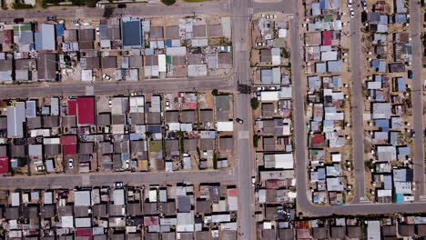 rdp houses with lots of corrugated iron shacks in township