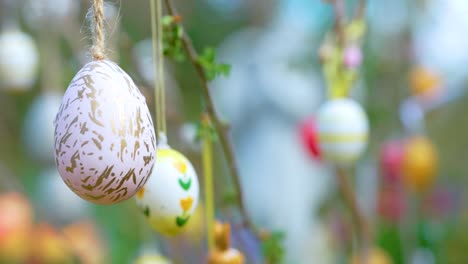 Easter-eggs-decorated-branches-concept-of-a-holiday-background-with-no-people,-easter-tradition-bokeh-shot